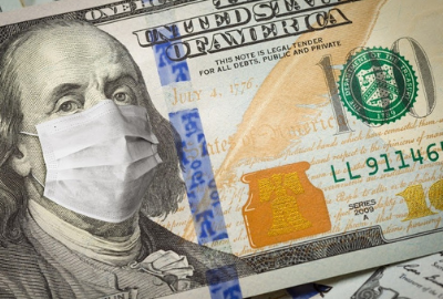A US $100 bill with Ben Franklin wearing a medical face mask.