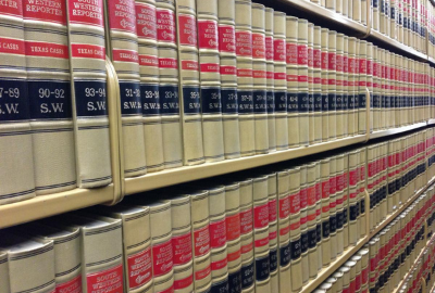 A close-up view of bookshelves holding hundreds of periodicals.