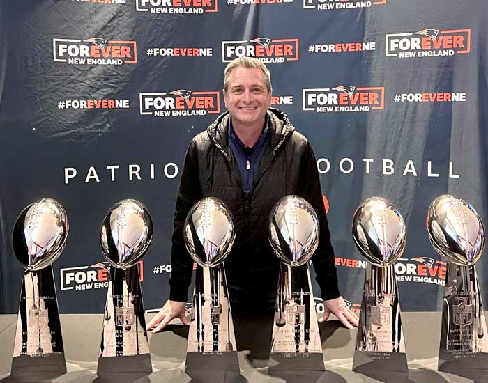 Jonathan Hitter with New England Patriots Super Bowl trophies.